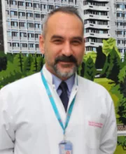 Associate Professor H. Erhan Güven